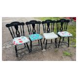 Set of four matching black wooden dining chairs