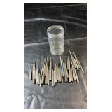 Collection of metal punches and drift tools in
