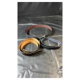 Three menï¿½s belts in black and brown tones with