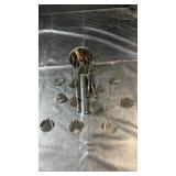 Black metal wind chime with hanging circular