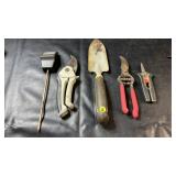 Collection of garden tools including a hand