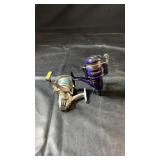 Two spinning fishing reels, including a