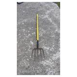 Long-handled garden fork with yellow handle and