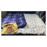 Two throw blankets, including a blue and red