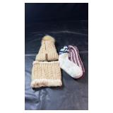 Cream cable-knit pom-pom hat with matching