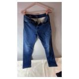 Blue mid-rise jeans, possibly size 8ï¿½10, with a