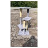 Tall grey cat tree featuring multiple carpeted