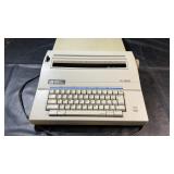 Smith Corona electric typewriter with power cord.