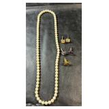 Cream pearl-style beaded necklace with several