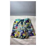 TNL shorts with colourful comic-style print,