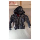 Dark hooded zip-up jacket with ï¿½The Thrill of the