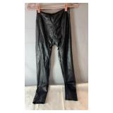 Black faux leather fitted pants with a sleek