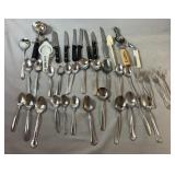 Mixed collection of kitchen flatware and utensils