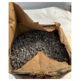 Box containing a large quantity of small metal
