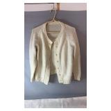 Cream knit cardigan, possibly size medium, with