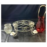 Decorative grouping featuring a clear glass vase