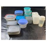 Thirteen plastic food storage containers in