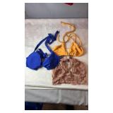 Three womenï¿½s bras including blue, yellow and