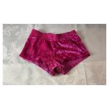 Bright pink velvet shorts with elastic waistband.