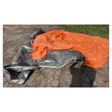 Two large outdoor tarps, one orange and one grey,