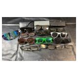 Collection of eyeglasses and sunglasses in a