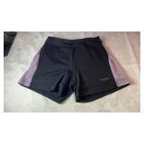 Black Running Room athletic shorts, possibly size