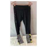 Black athletic leggings, possibly size