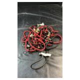 Collection of red and black elastic bungee cords