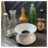 Collection of decorative bottles including clear,