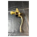 Brass finish entry door hardware featuring a
