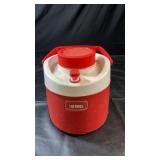 Red and white Thermos insulated beverage jug with