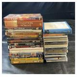 Collection of DVDs and music CDs featuring