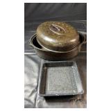 Black speckled enamel cookware featuring a large
