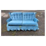 Blue upholstered hideaway sofa bed featuring two