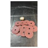 Fourteen sanding discs with centre holes,