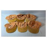Six Labatt Copper baseball-style caps in a tan