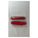 Two red folding multi-tool pocket knives