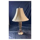 Tall table lamp with tapered decorative base and