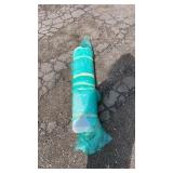 Roll of roofing paper wrapped for storage. Size