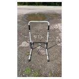 White metal bedside assist rail with padded grip