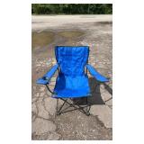 Blue folding outdoor chair with armrests, cup