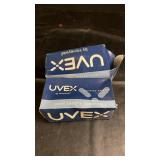 Two boxes of UVEX by Honeywell safety goggles.