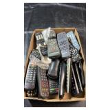 Box filled with various TV, cable, VCR and