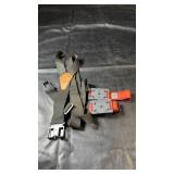 Pair of orange ice cleats with metal traction