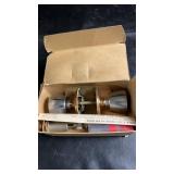 Box containing door knob and lock hardware with