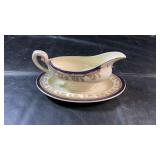 Cream-coloured Royalty 1658 gravy boat with