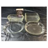 Four clear glass baking dishes, including two