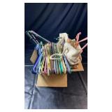 Collection of plastic and metal clothes hangers