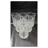 Set of six clear drinking glasses featuring