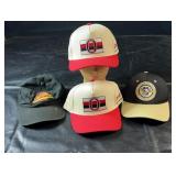Collection of four NHL baseball caps featuring a